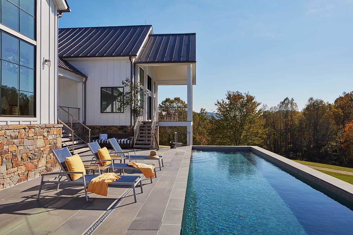 modern farmhouse exterior with a pool