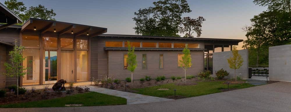 modern mountain home exterior at dusk