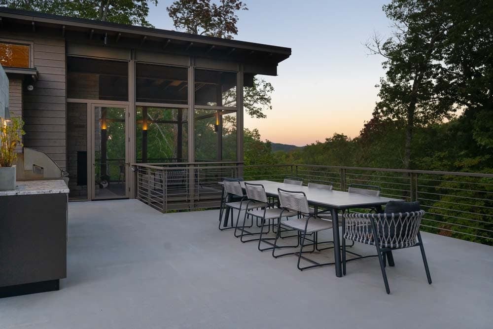 modern mountain home exterior backyard patio with alfresco dining