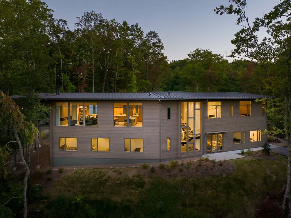 modern mountain home exterior at dusk