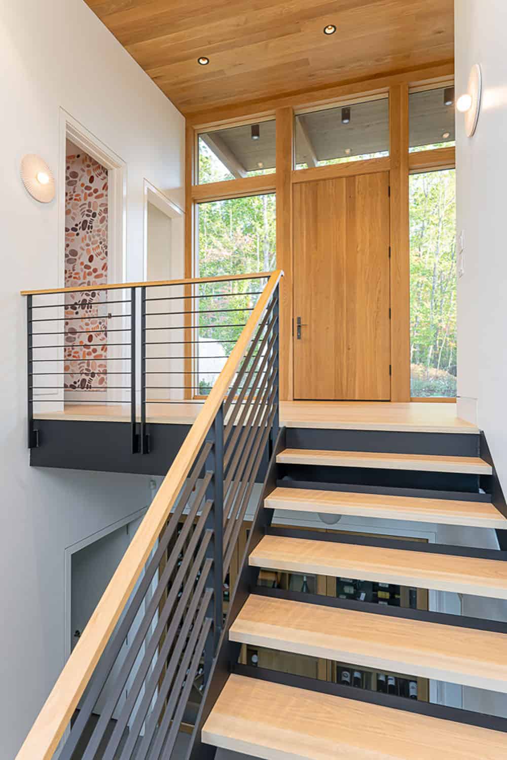 modern mountain home entry with a staircase