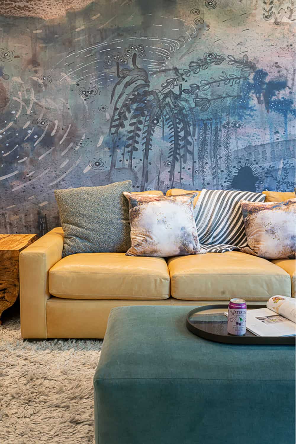 modern basement level family room with an art mural wall
