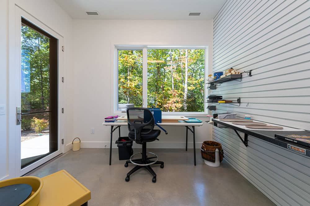 modern basement level art room with pottery wheel