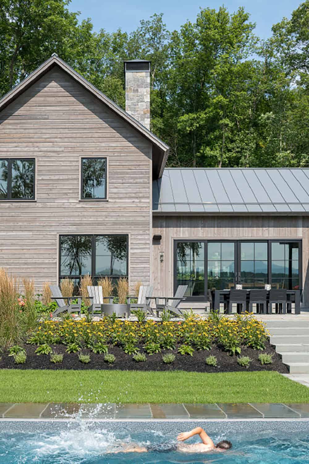 modern rustic home exterior with a pool