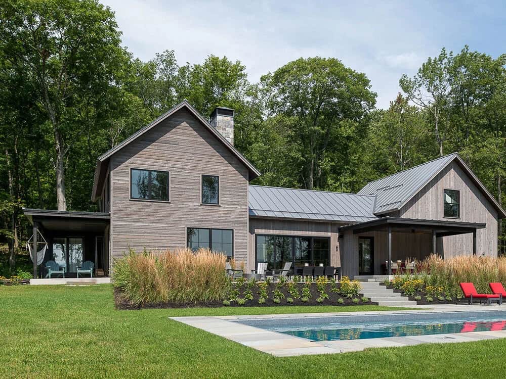 modern rustic home exterior with a pool