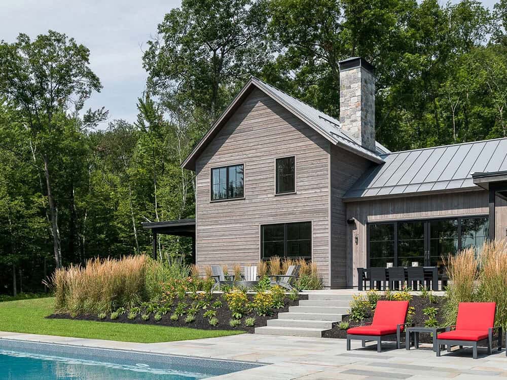 modern rustic home exterior with a pool