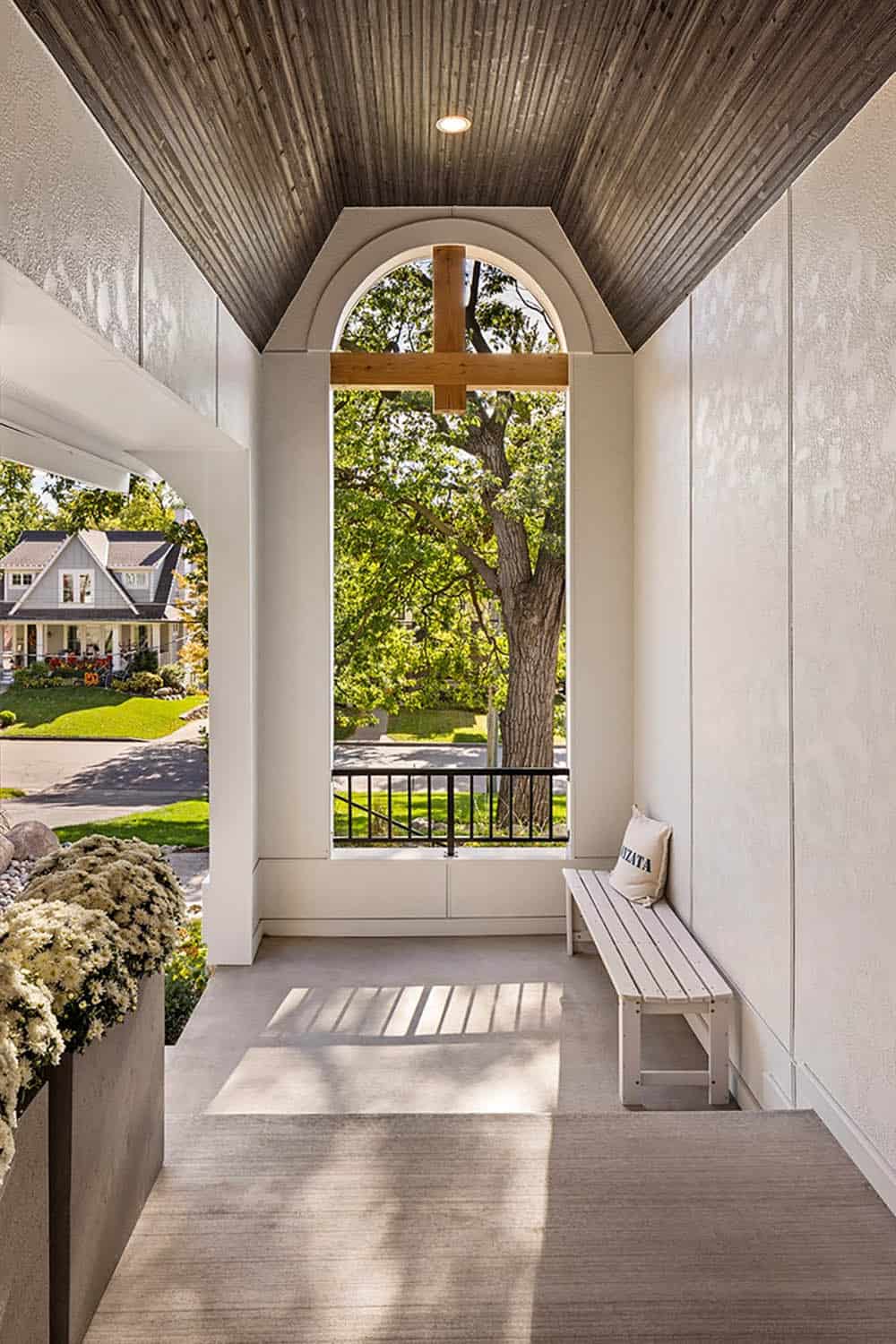 modern tudor style home covered front porch