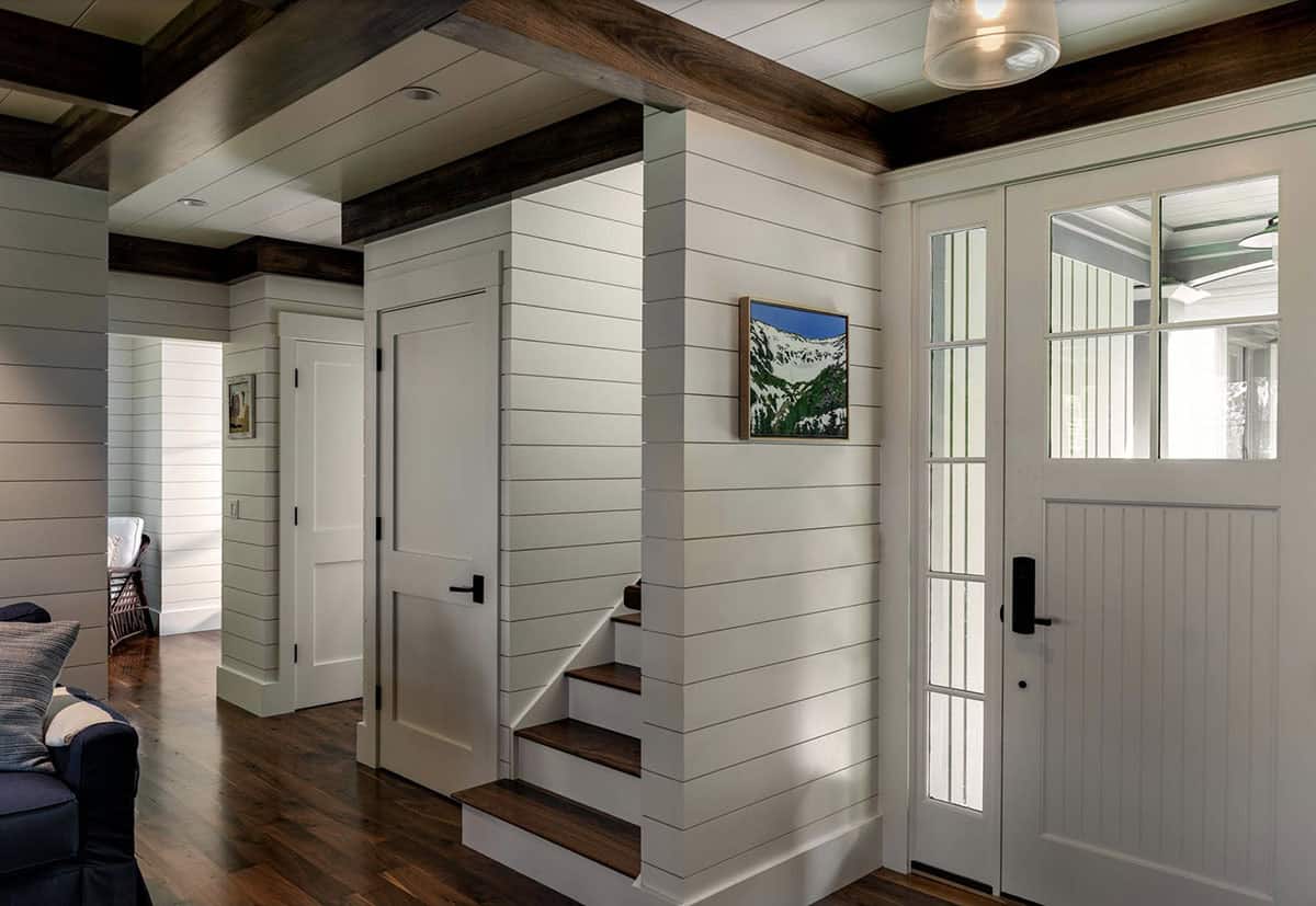 Craftsman home entry with a staircase
