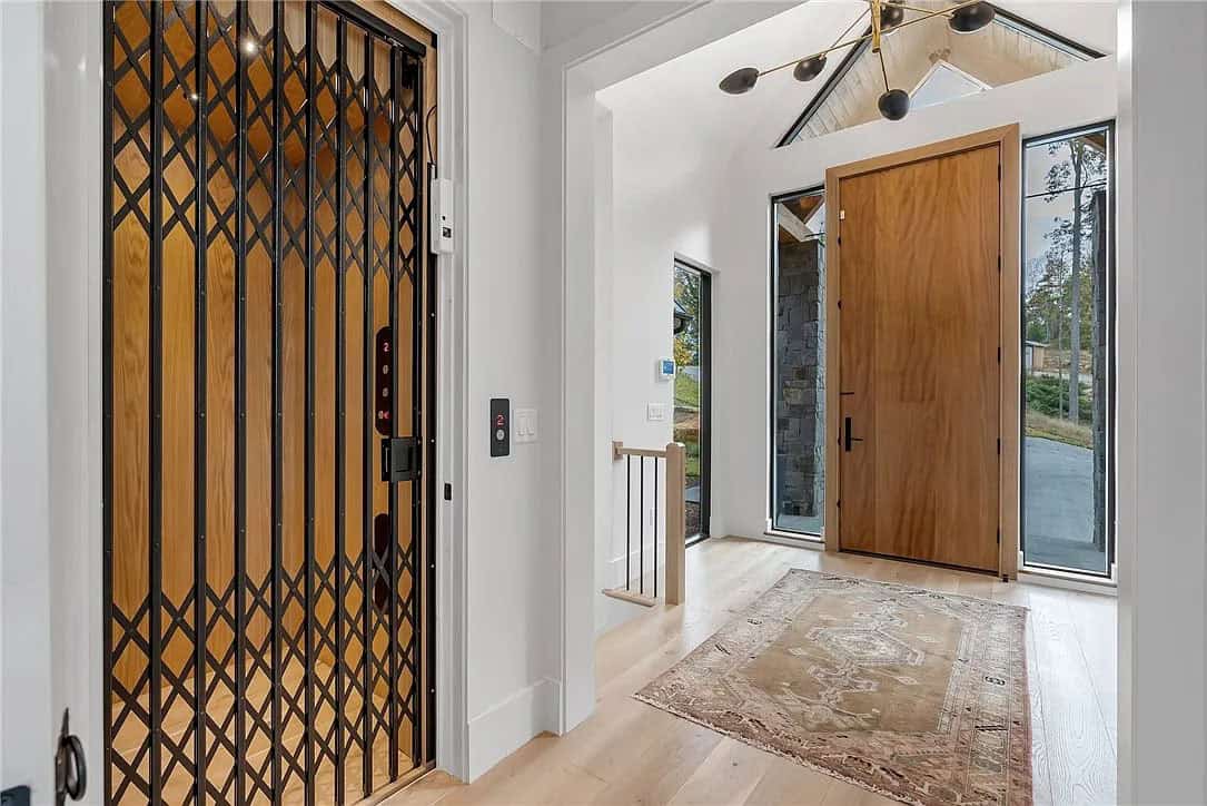 contemporary lake house entry with an elevator