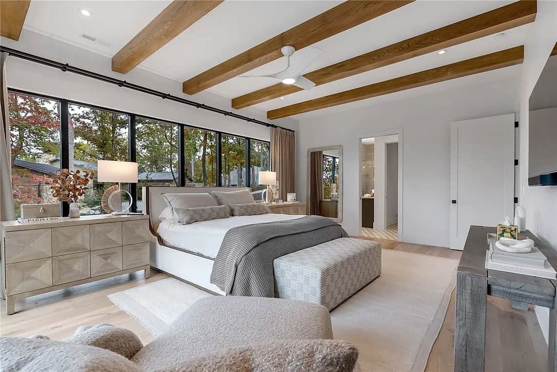 contemporary bedroom with wood ceiling beams