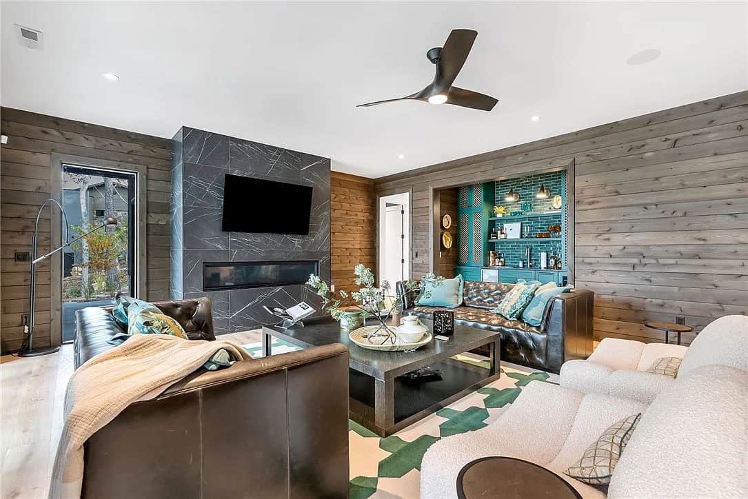 contemporary family room with a fireplace