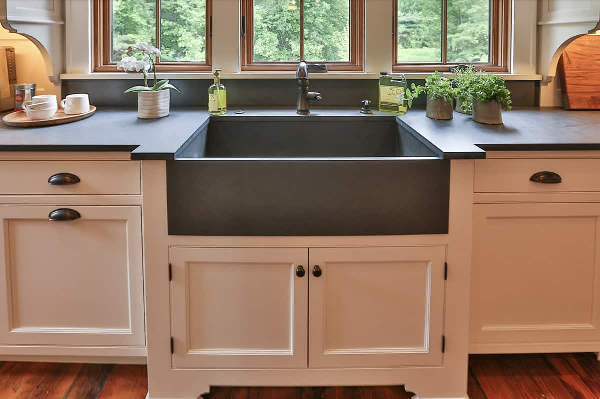 farmhouse style kitchen sink with a window