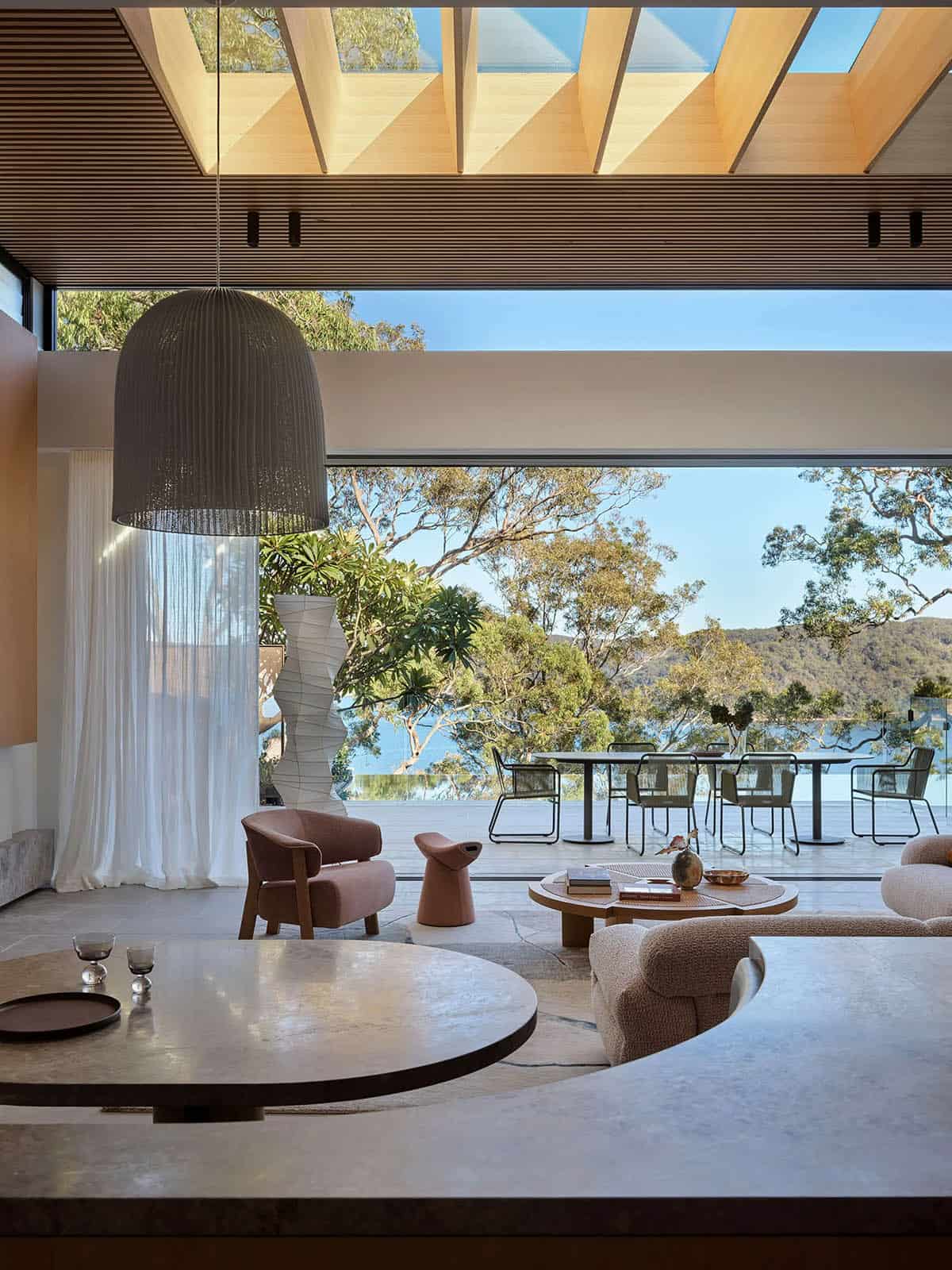 living room with a large window and a large table.