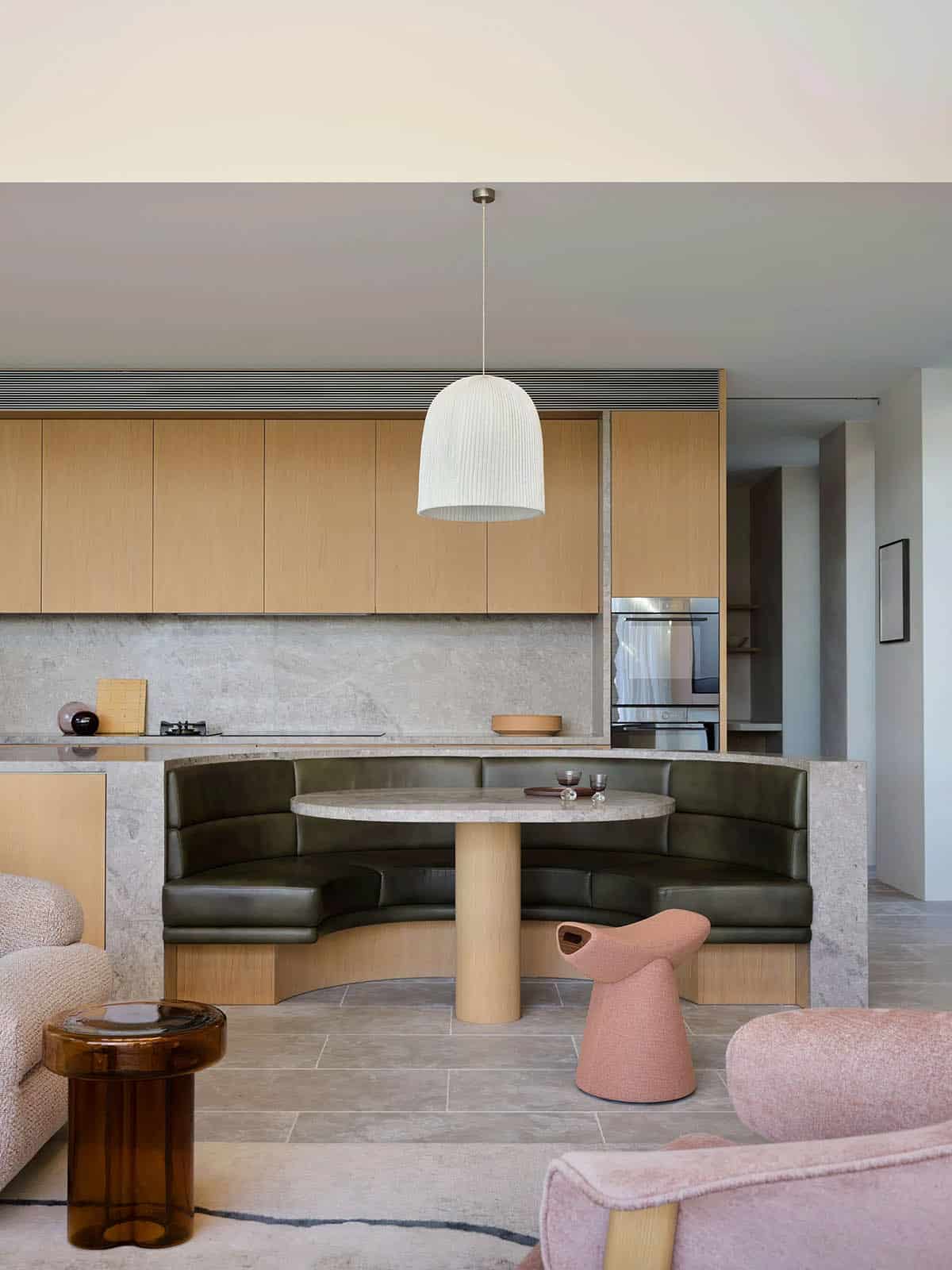 A modern kitchen with a built-in banquette