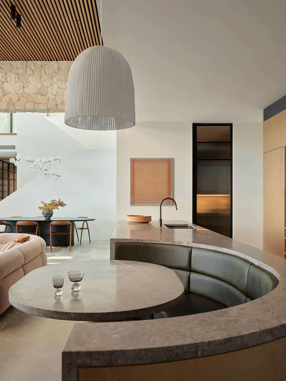 A modern kitchen with a built-in banquette