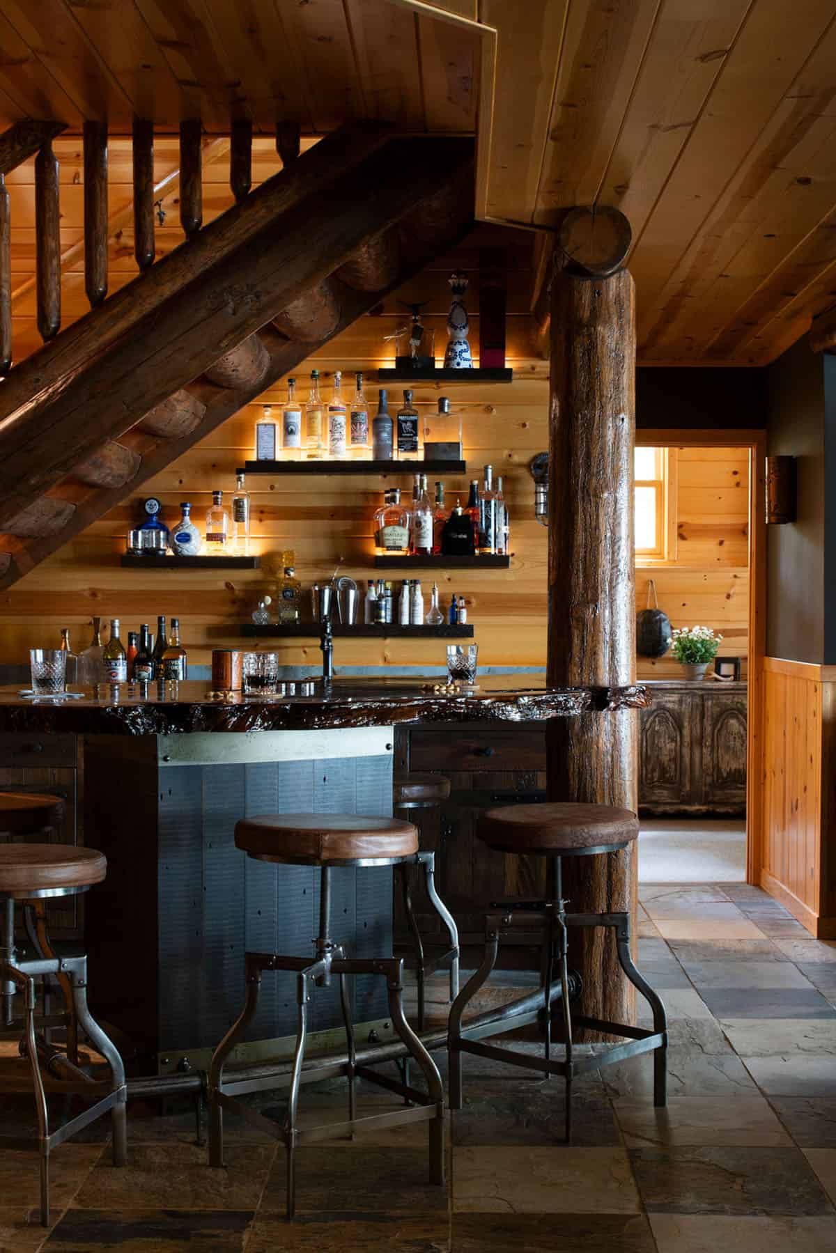 rustic home bar under the staircase