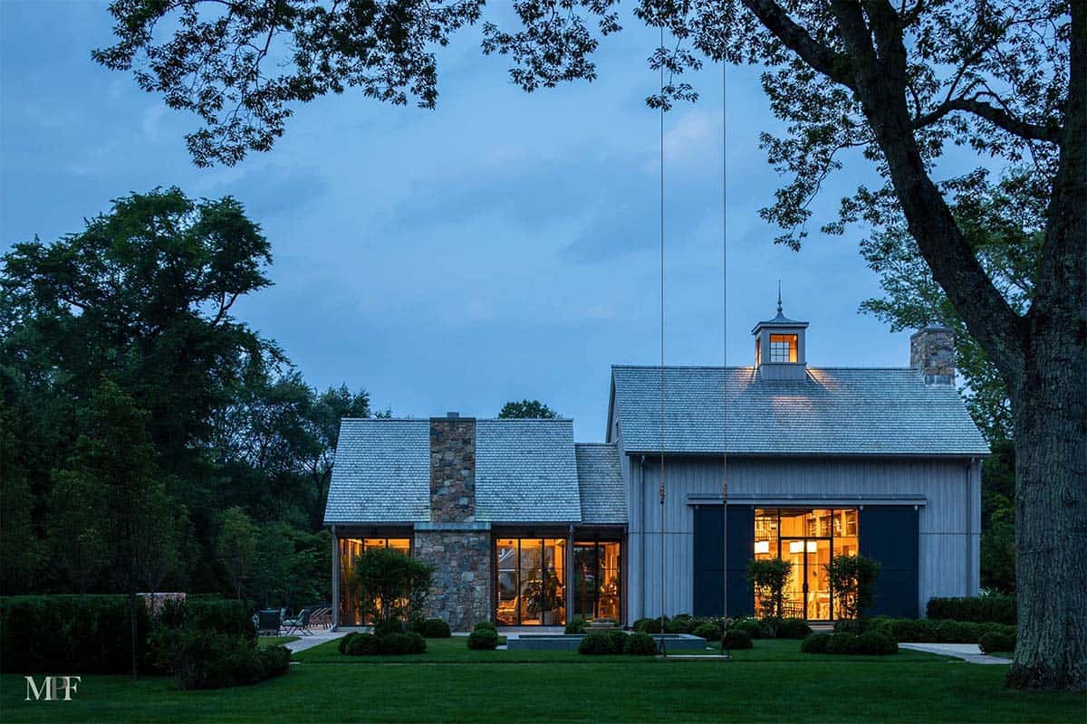 modern rustic barn house exterior at dusk