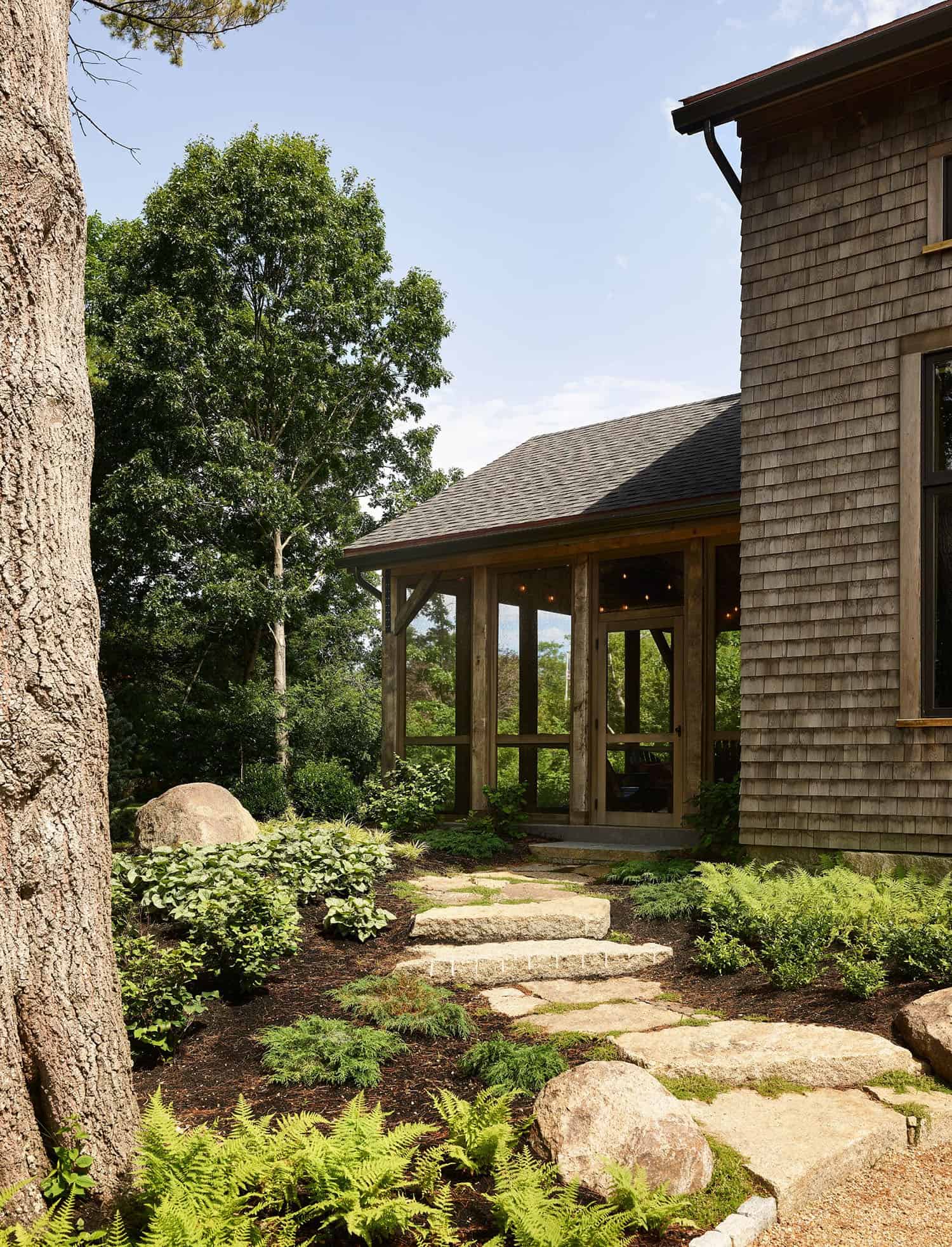 rustic modern barn house exterior with a pathway