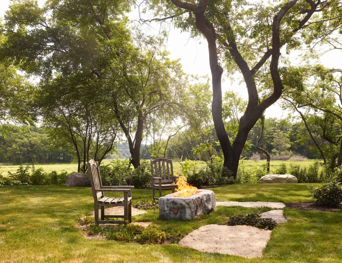 modern rustic barn house landscape with a fire pit