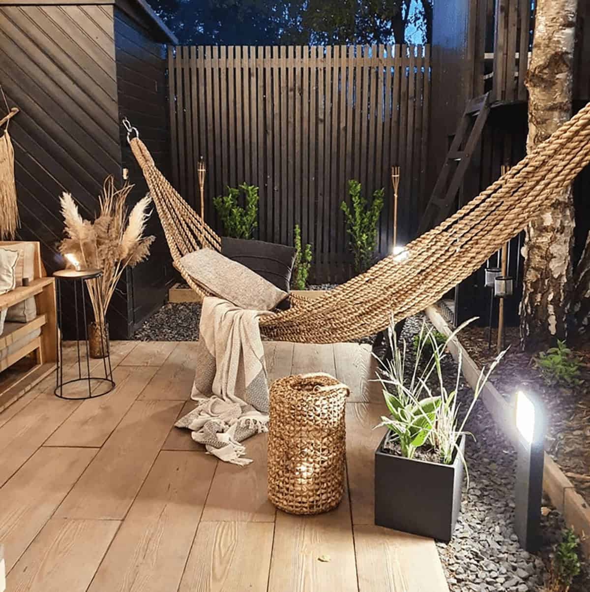 small backyard deck with a hammock