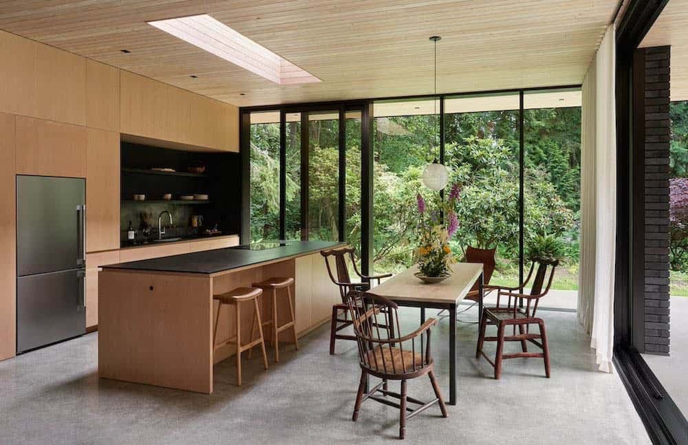 modern kitchen and dining room with sliding glass doors