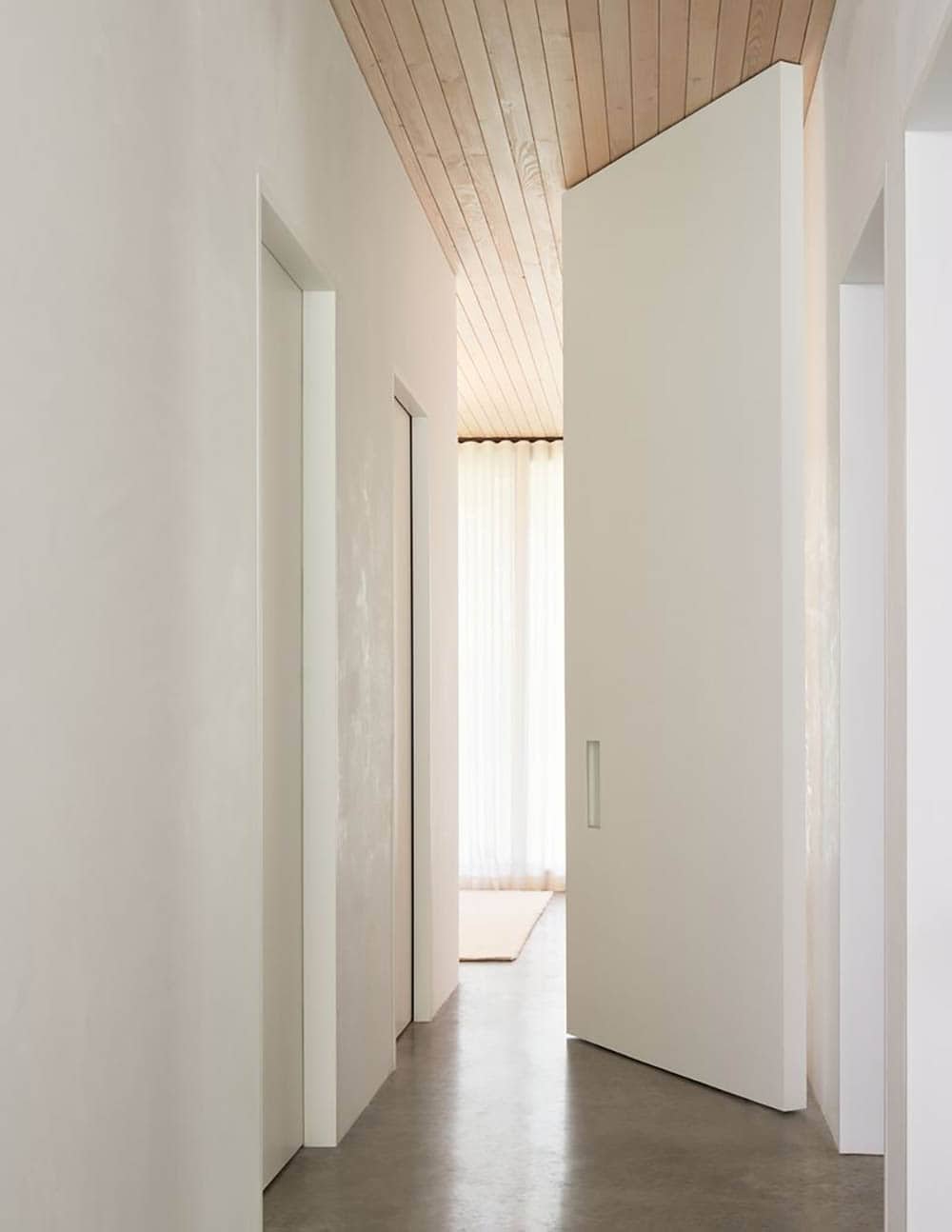 modern hallway entry into the main bedroom