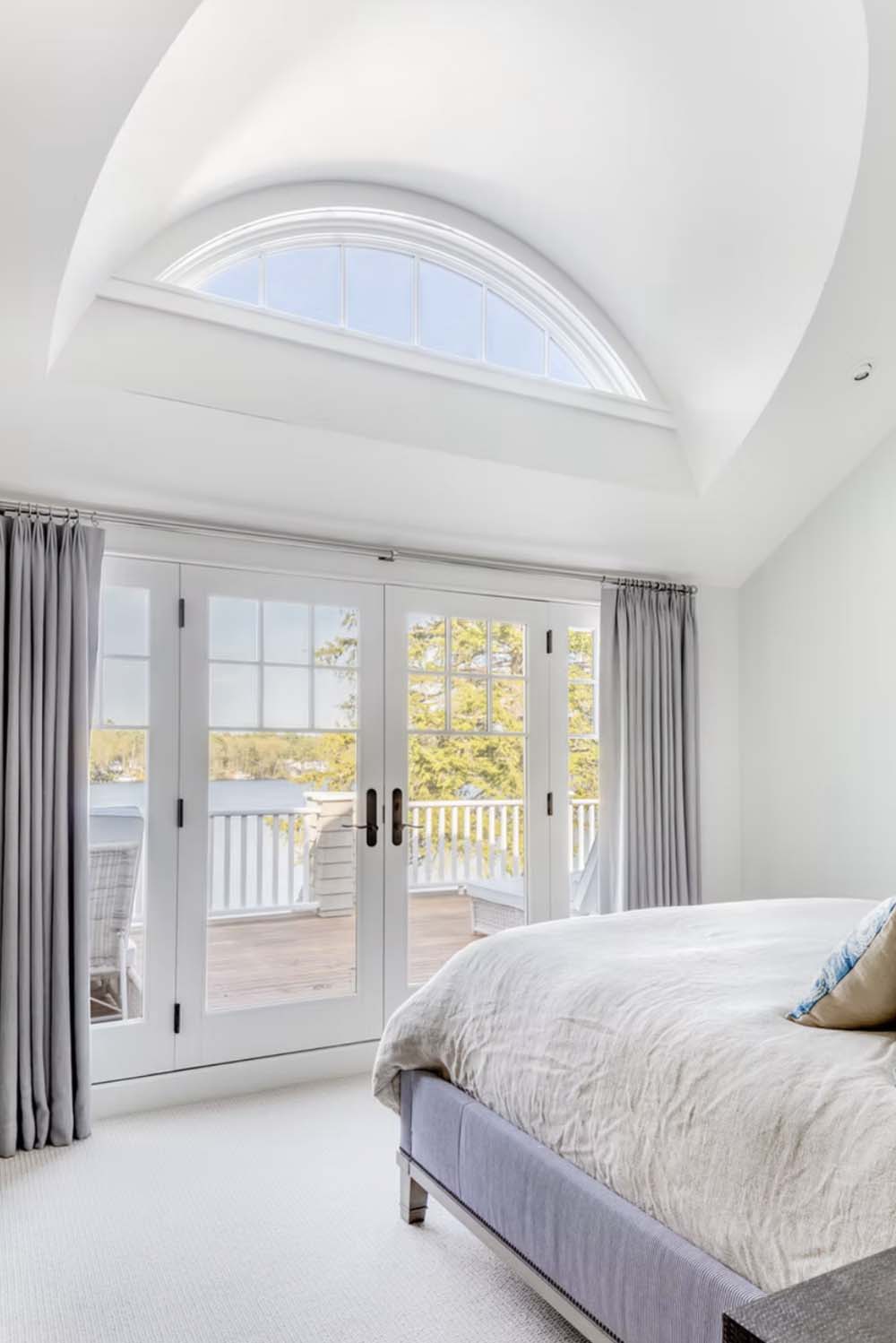 coastal style bedroom with french doors
