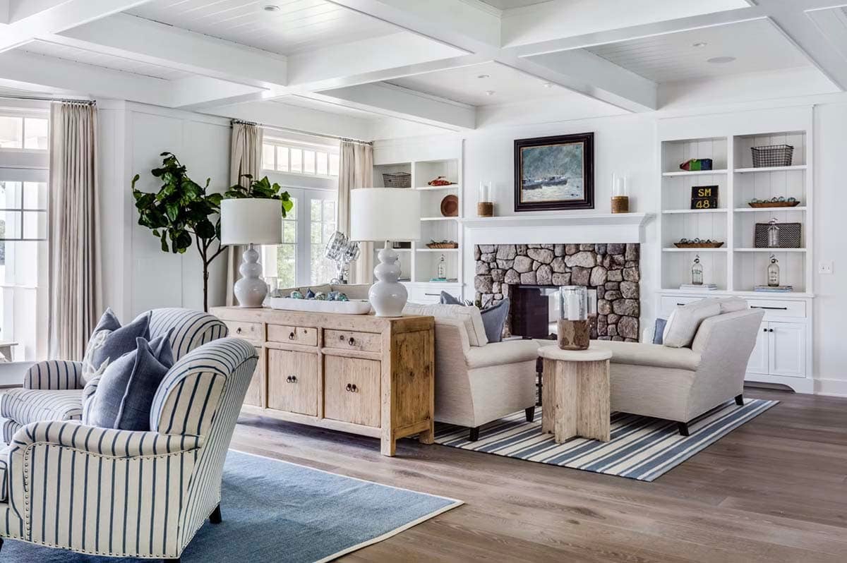coastal style living room with a fireplace