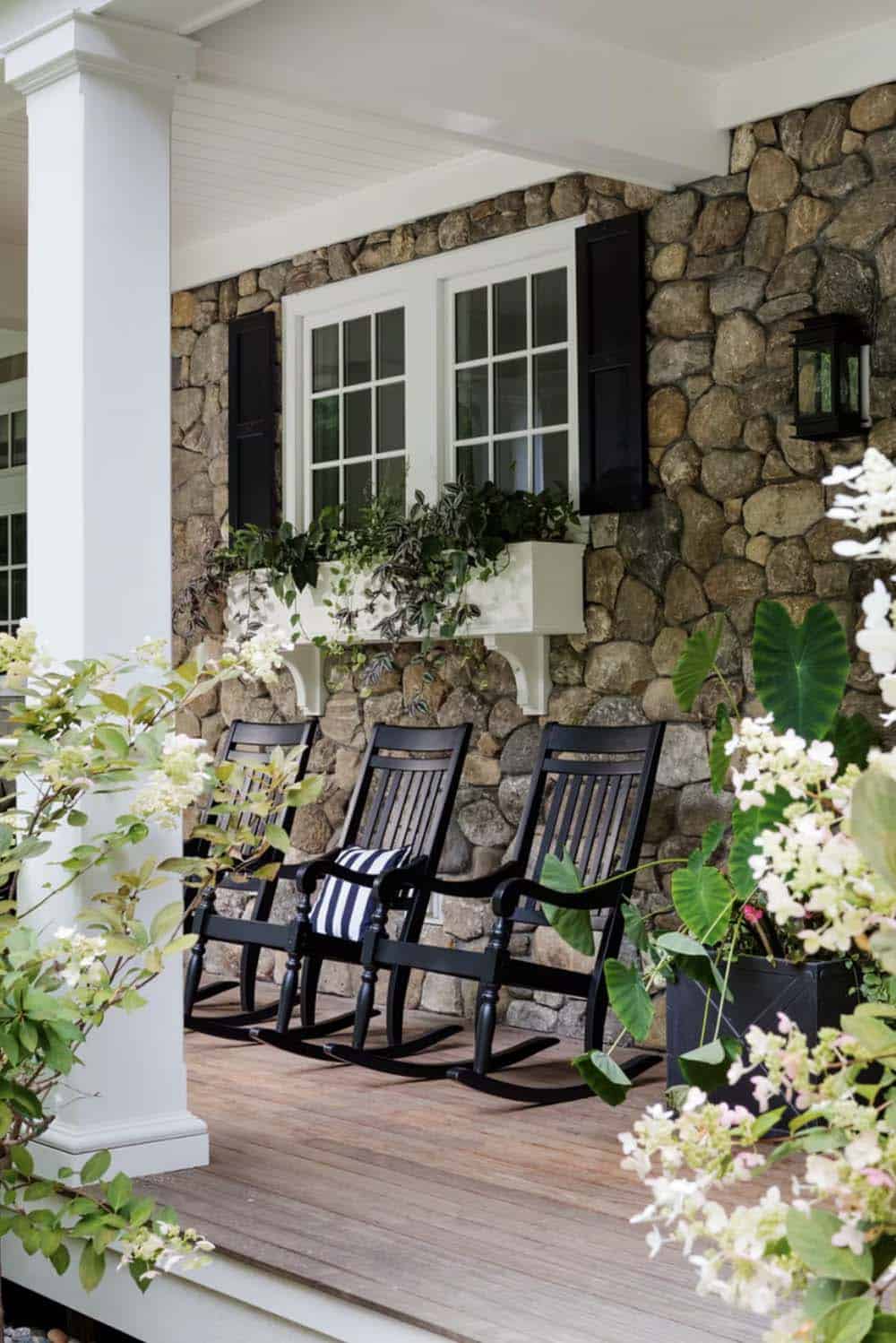 coastal style home exterior front porch with rocking chairs