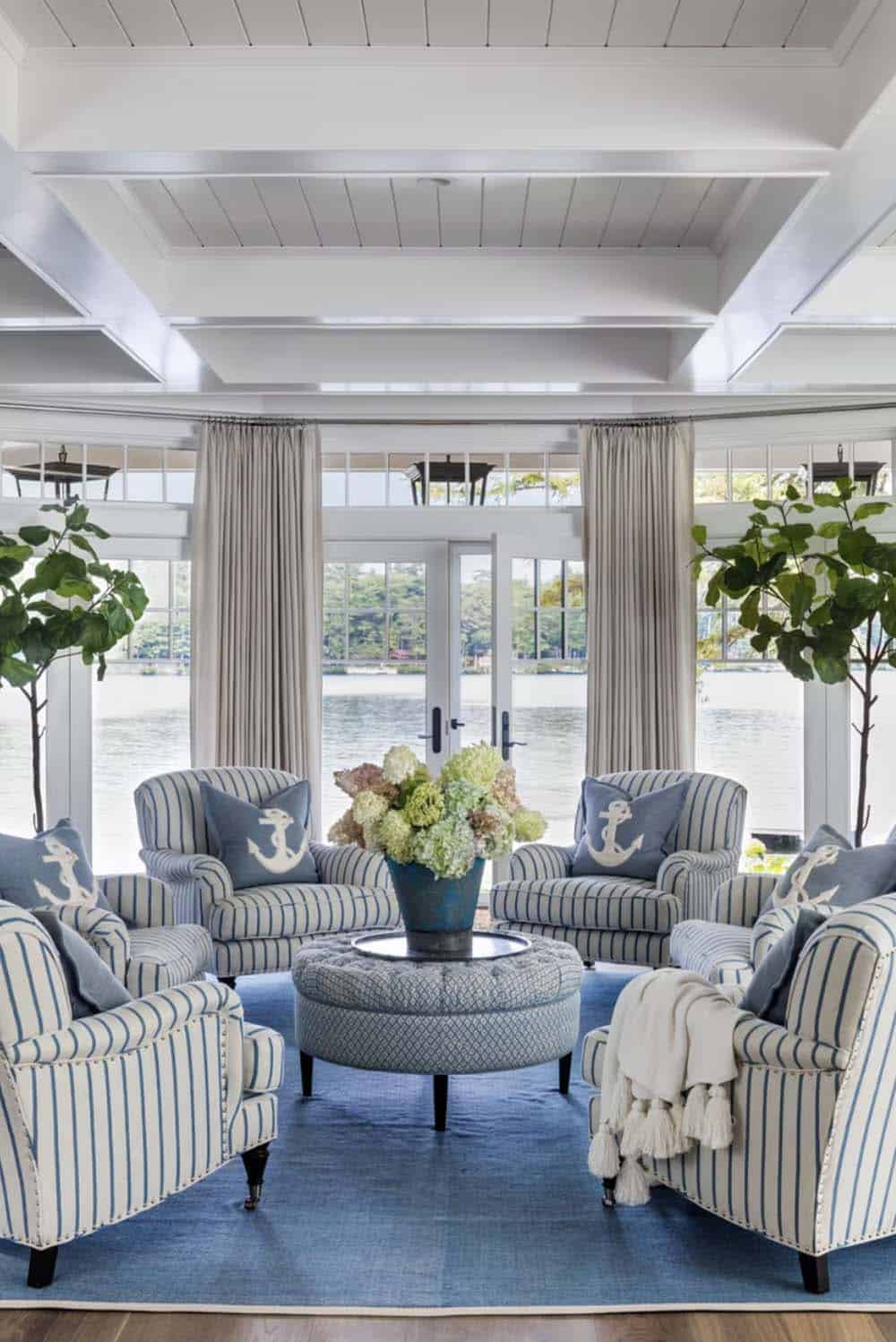 coastal style living room with floor-to-ceiling windows