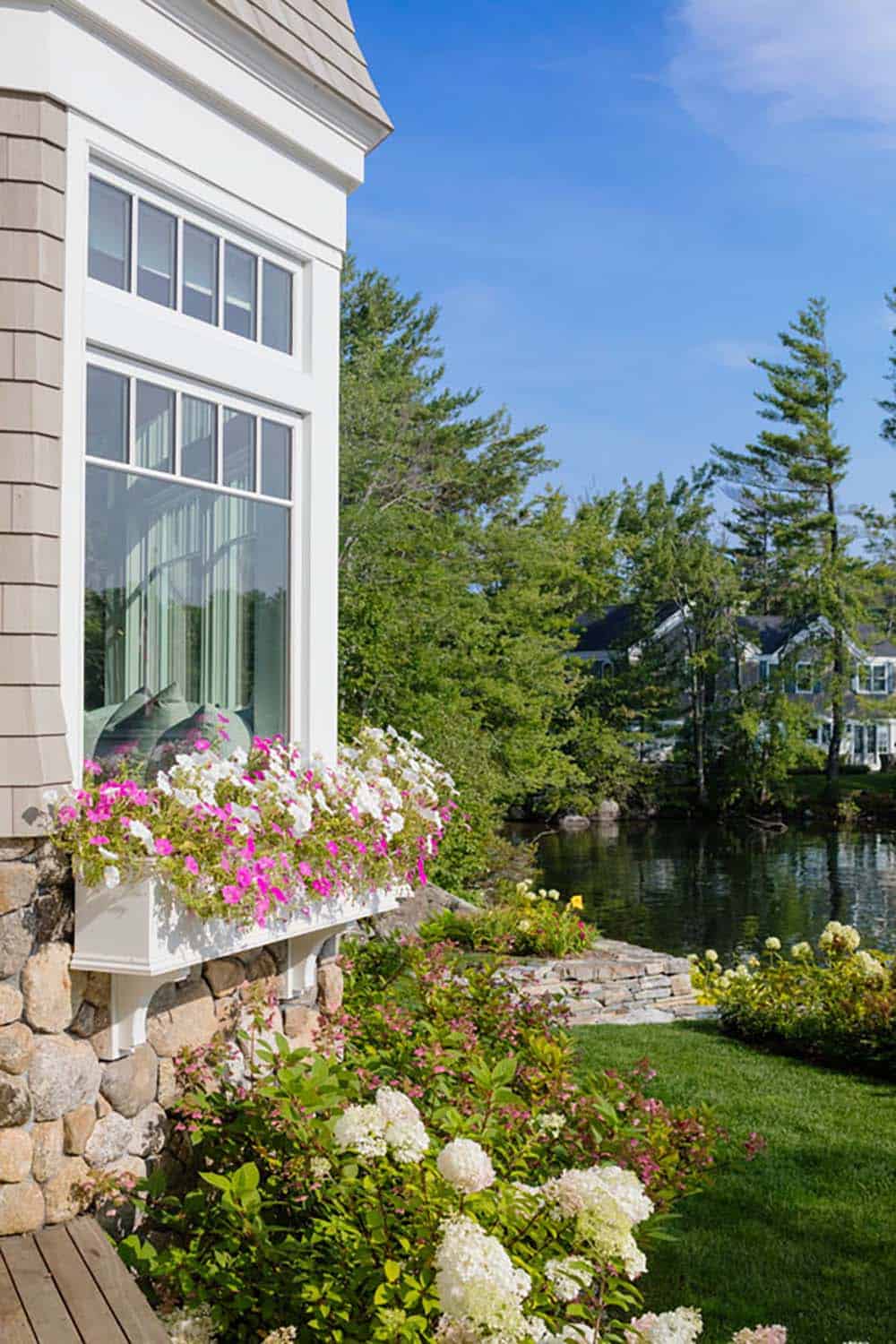 coastal style home exterior with a flower window box