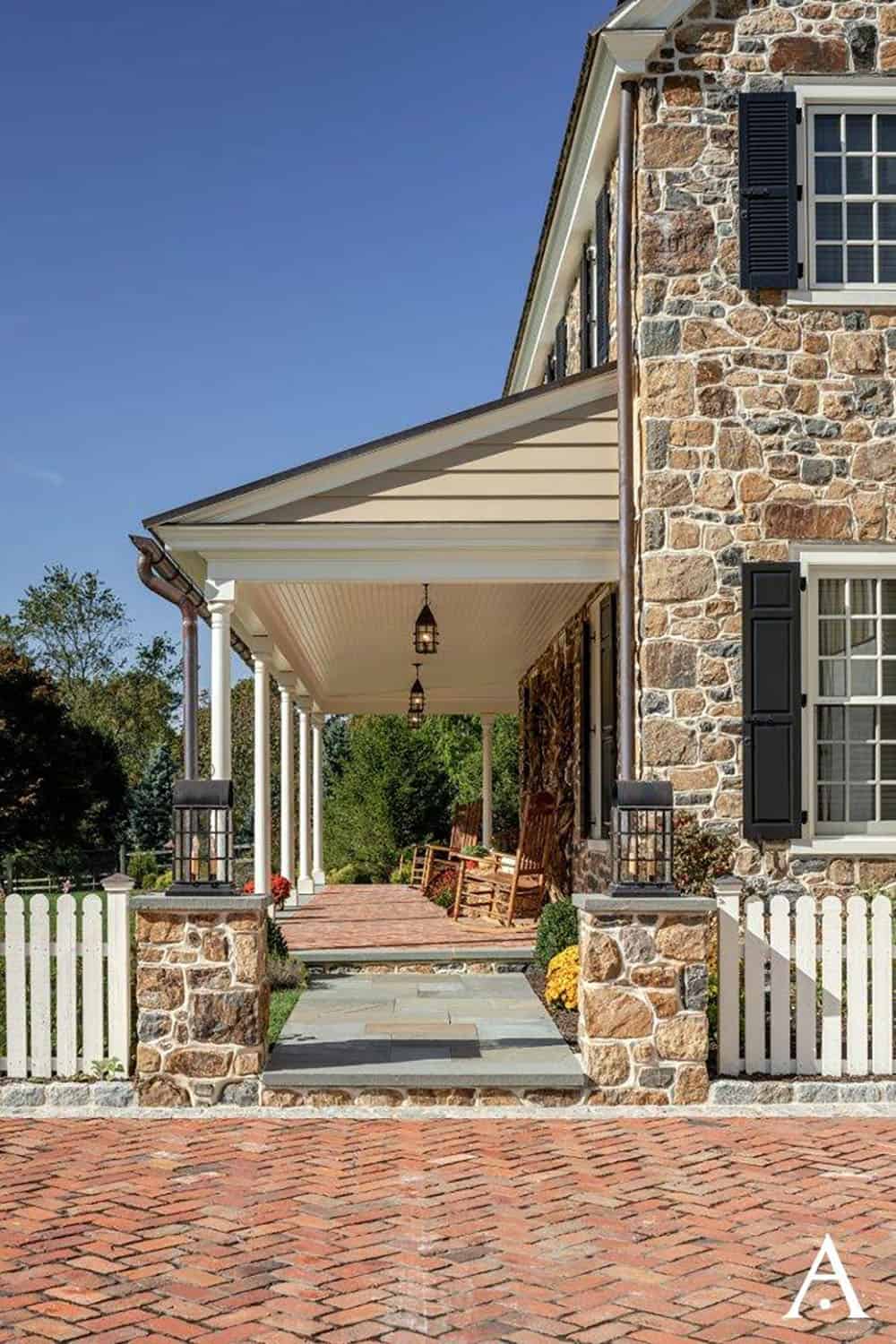 stone farmhouse home exterior covered front porch