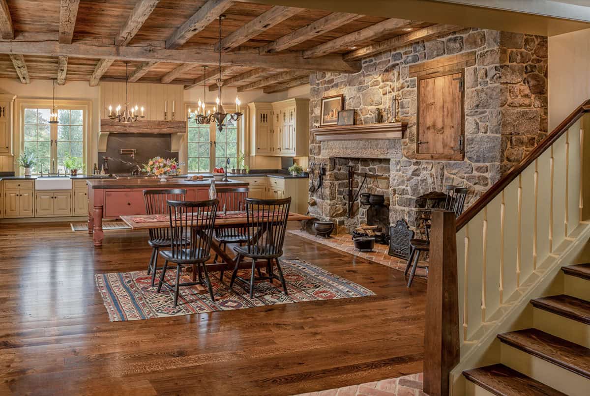 traditional style kitchen and dining area with a fireplace
