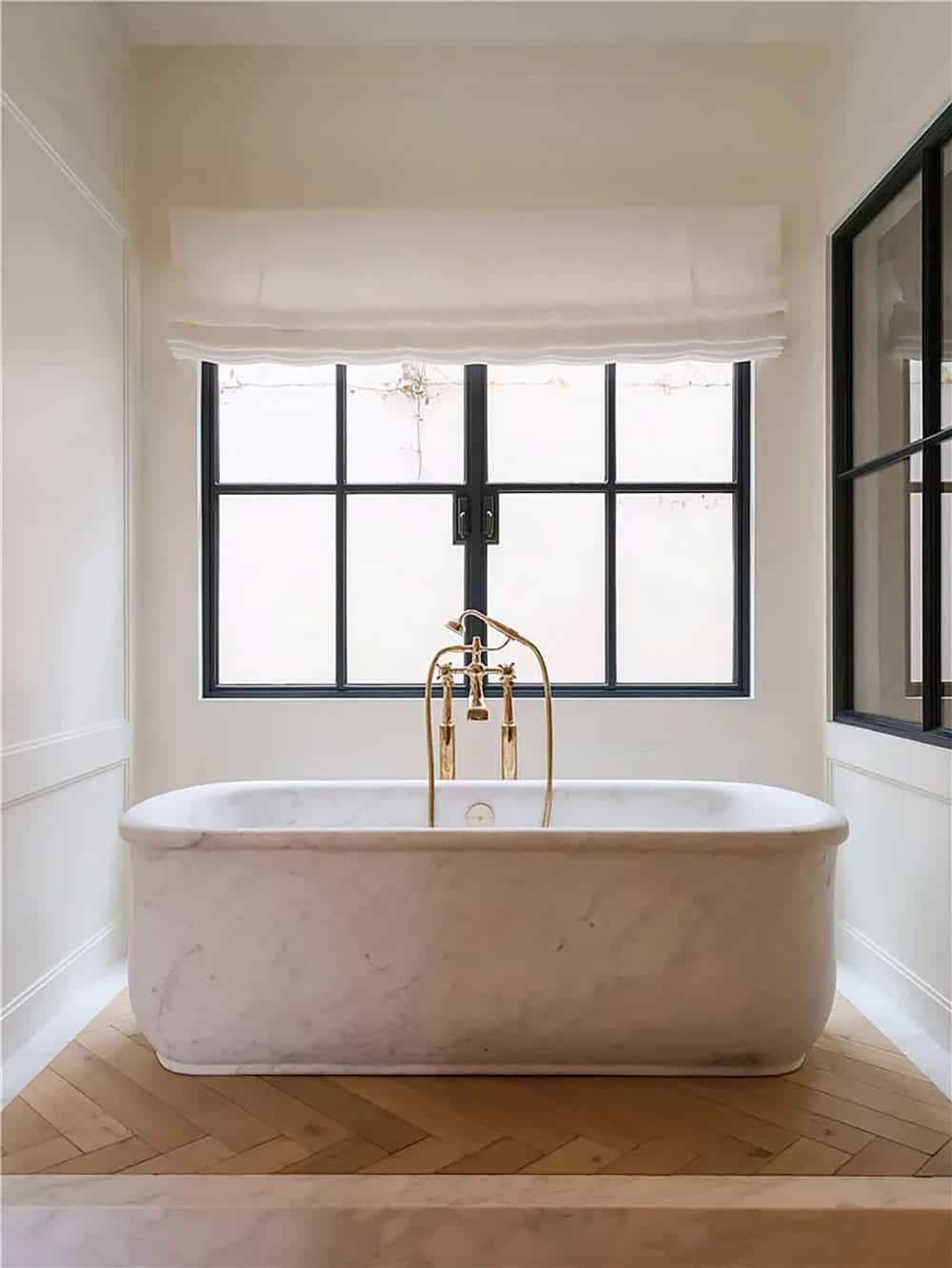 transitiional style bathroom with a freestanding tub