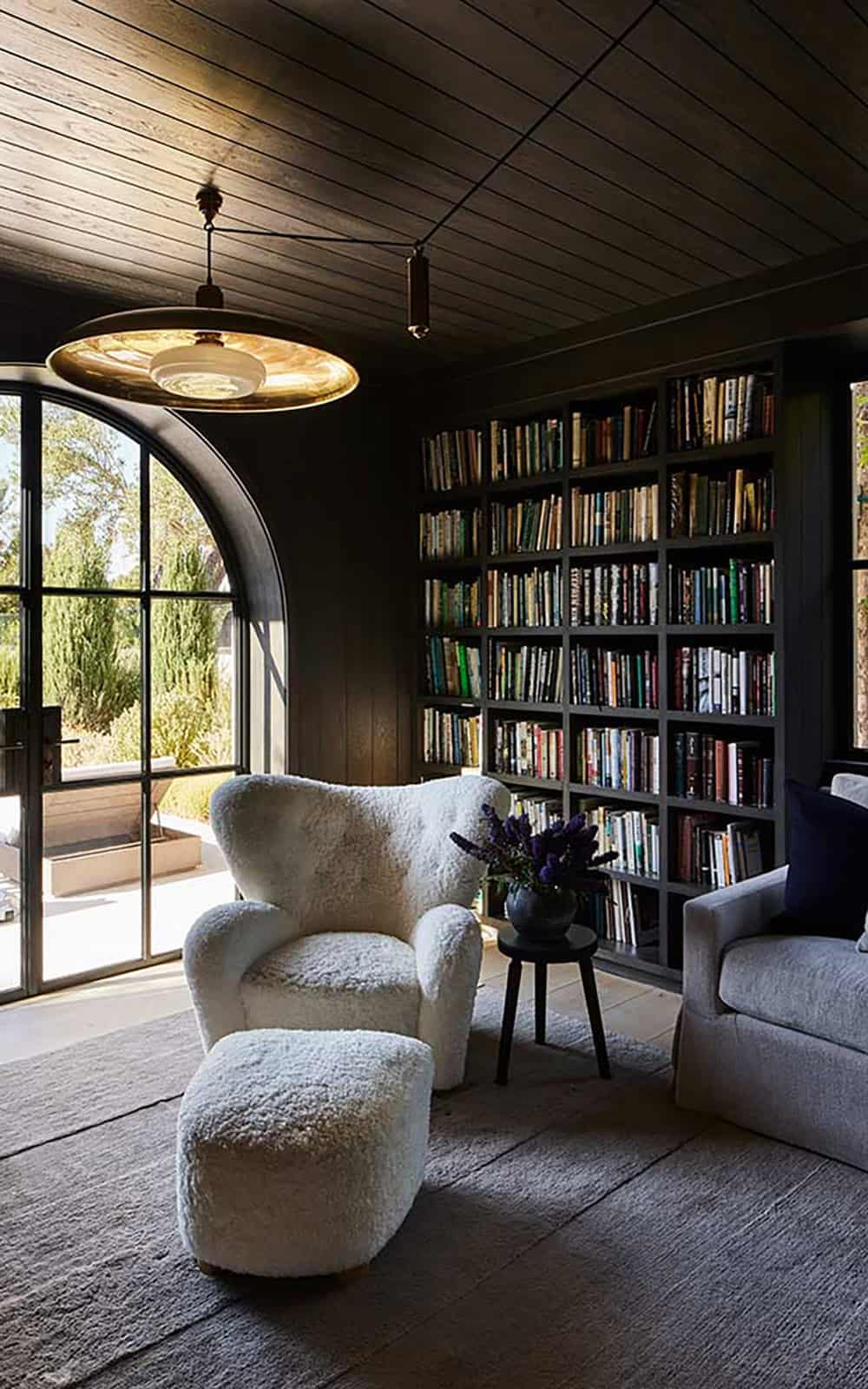transitiional style family room with built-in bookshelves