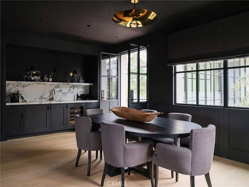 transitiional style dining room with a home bar