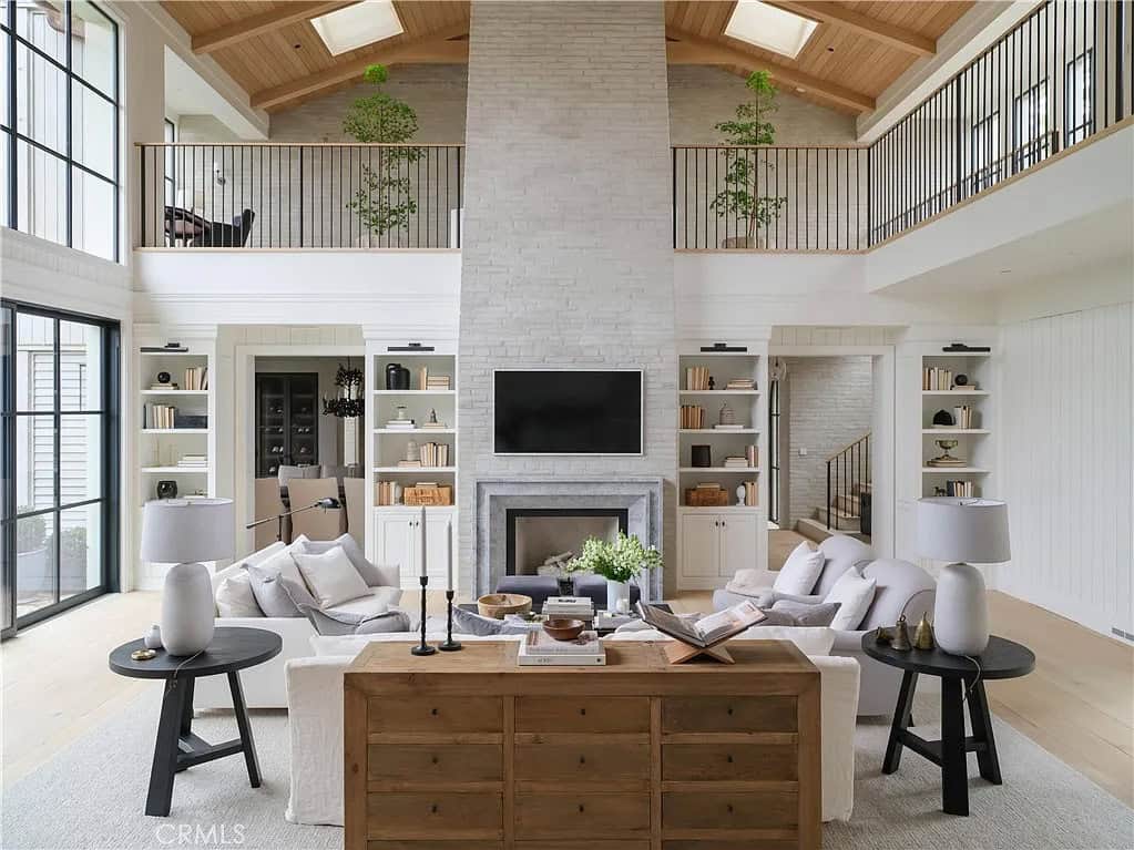transitiional style great room with a fireplace
