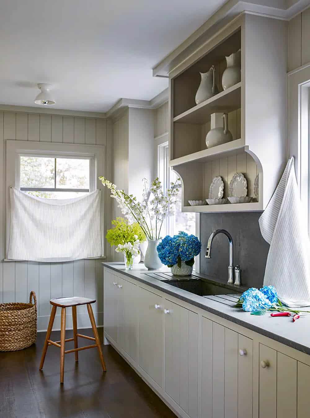 transitional style kitchen pantry with a sink