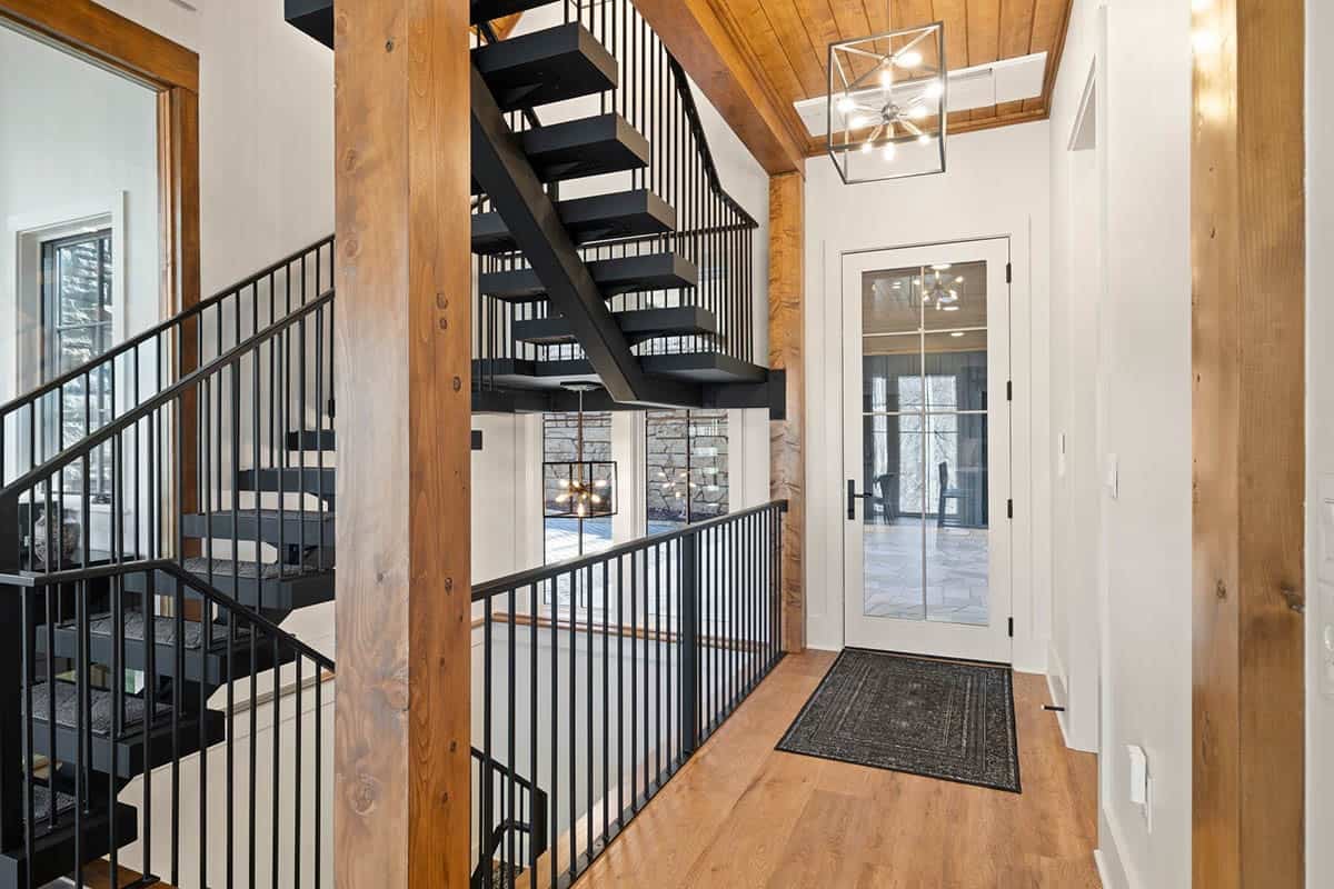 mountain cottage entry with a staircase