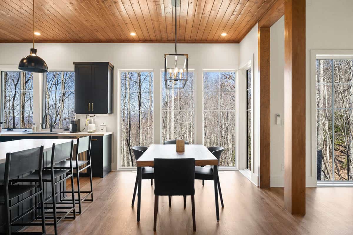 mountain cottage dining room with a large window