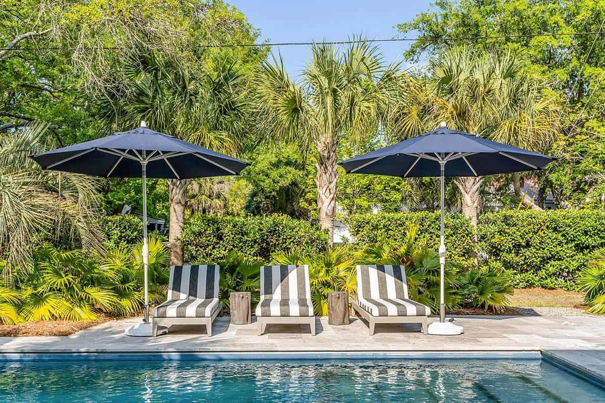 beach style house exterior with a pool