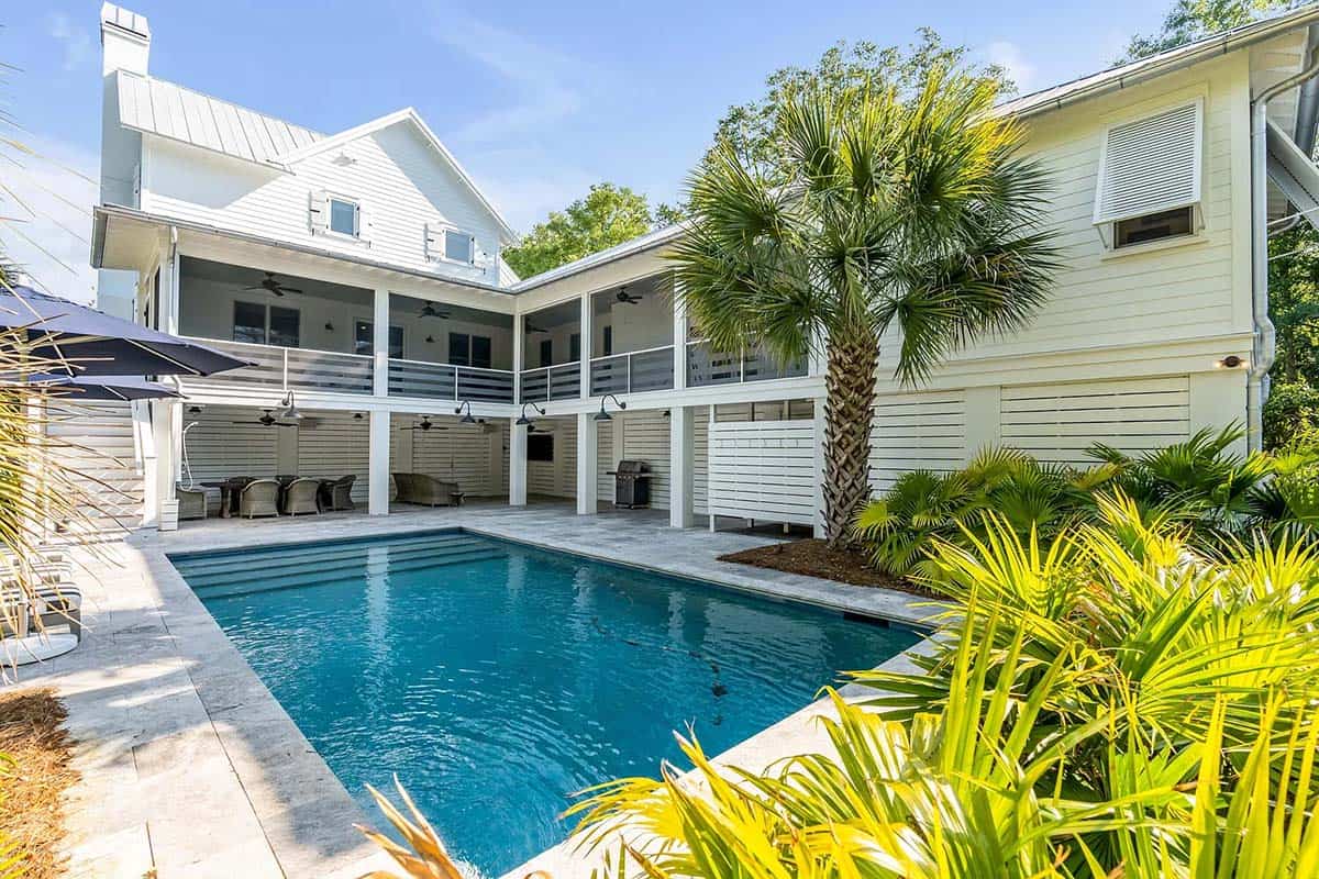 beach style house exterior with a pool