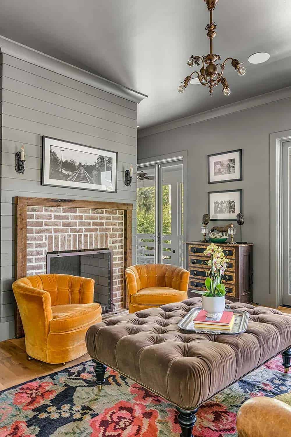 beach style living room with a fireplace