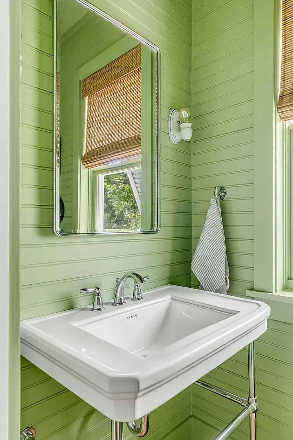 beach style powder room with green walls