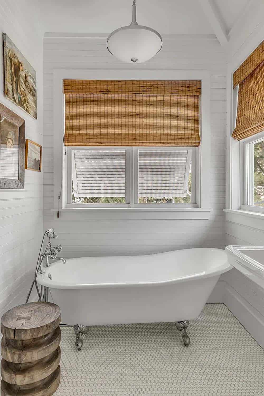 beach style bathroom with a freestanding tub