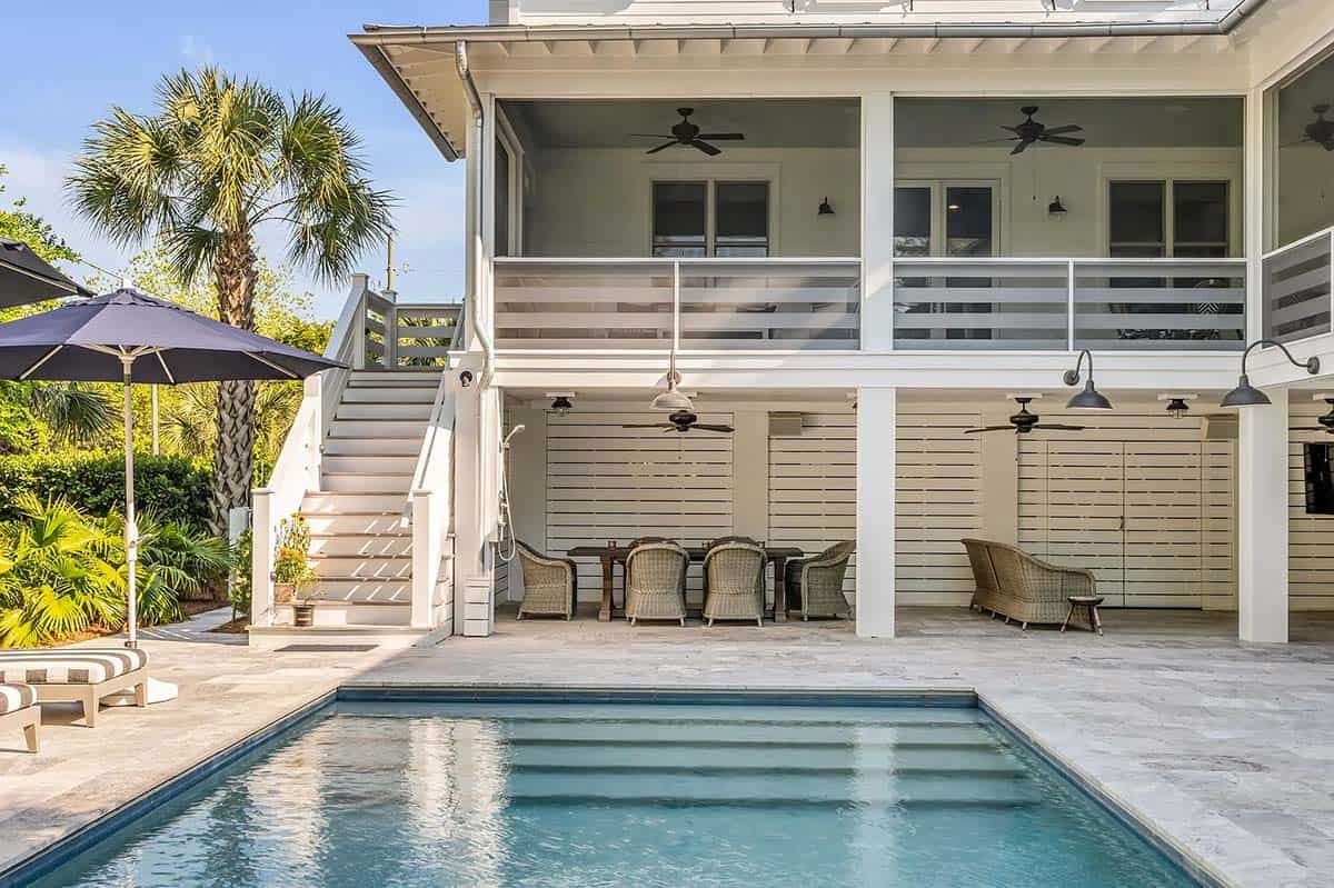 coastal style house exterior with a pool