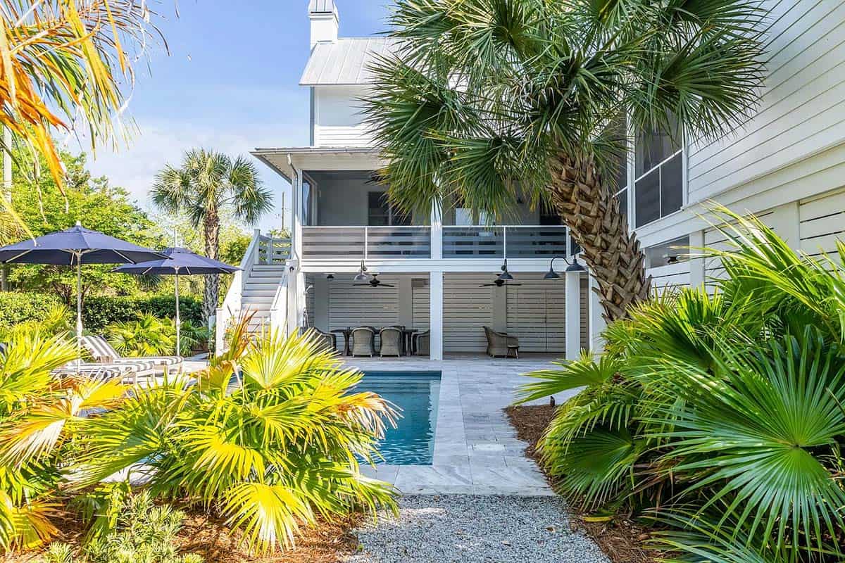 coastal style house exterior with a pool