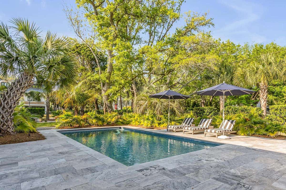 coastal style house exterior with a pool