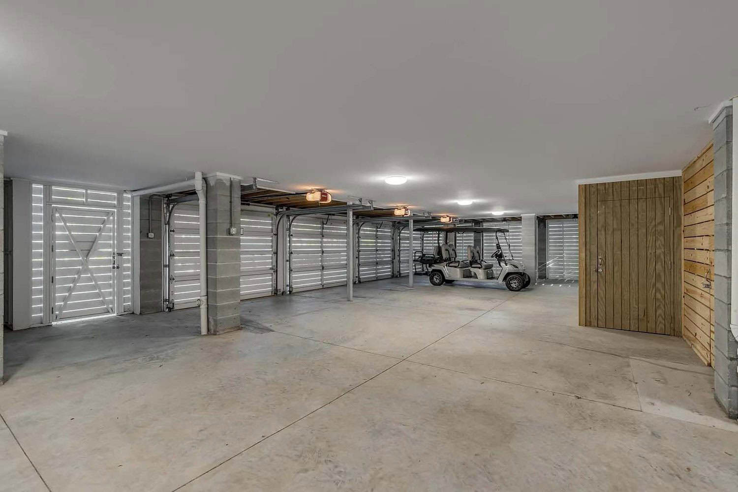 coastal style house with a garage