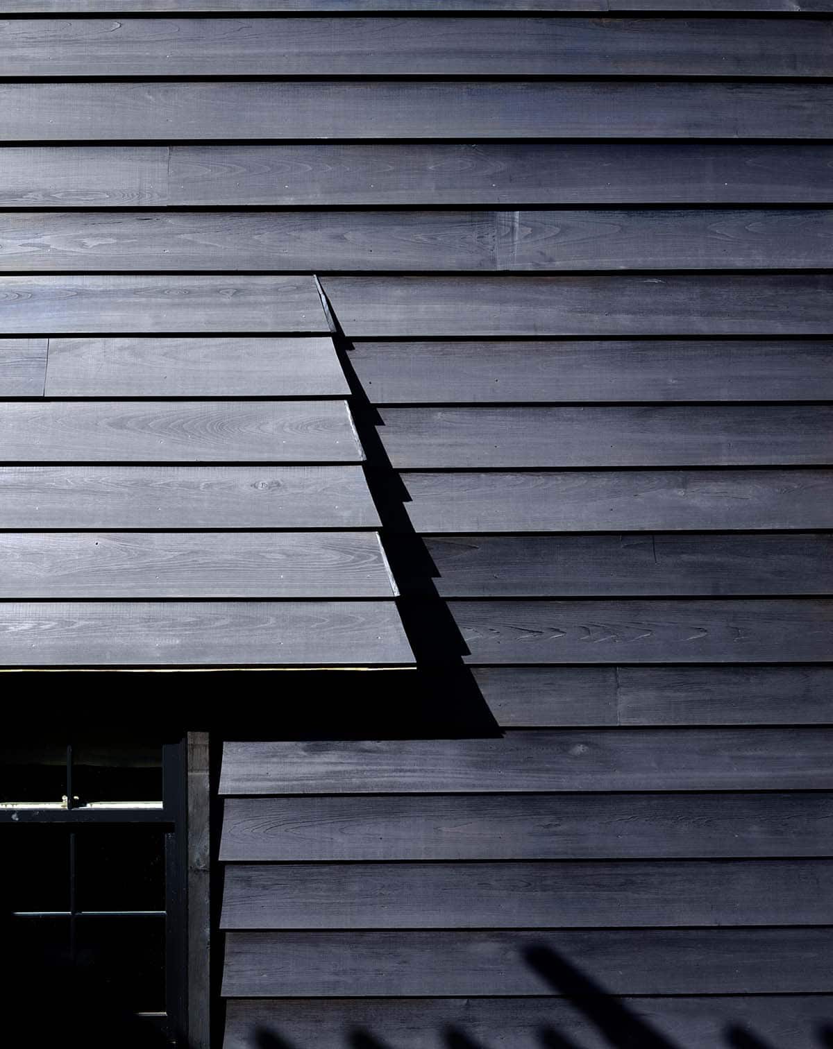 chalet-inspired lake house exterior roof detail